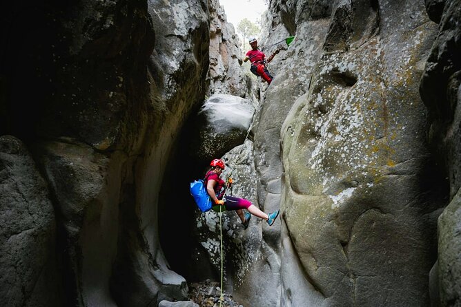 Canyoning in Tenerife South - Going down the canyon: narrow basalt walls and varied rappelling