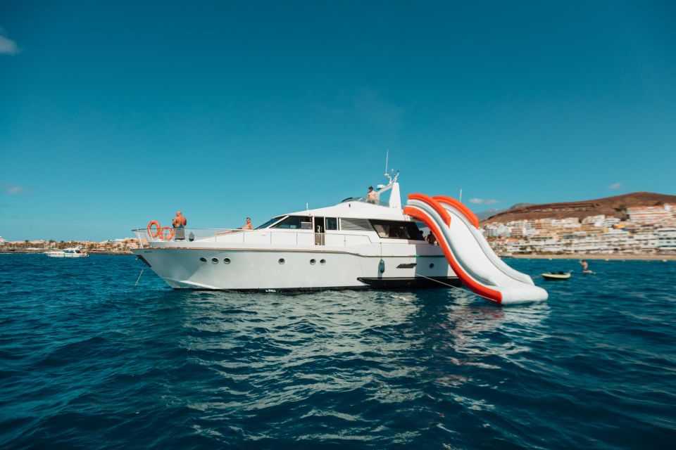 Costa Adeje: Private Yacht Trip with Watersports and Slides - PalmMar aquatic cave stop: where the water toys make sense