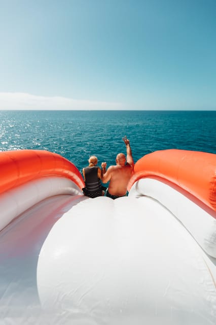 Costa Adeje: Private Yacht Trip with Watersports and Slides - Lunch and drinks on the water: what’s included and how to plan for it