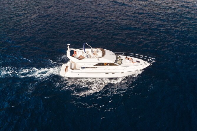 Private Boat Tour on Royal Ocean Yacht, Tenerife - Onboard comfort you’ll actually notice: seating, restroom, and included towels